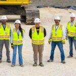 Construction worker wearing safety gear and helmet