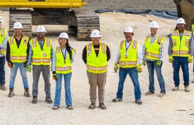 Construction worker wearing safety gear and helmet